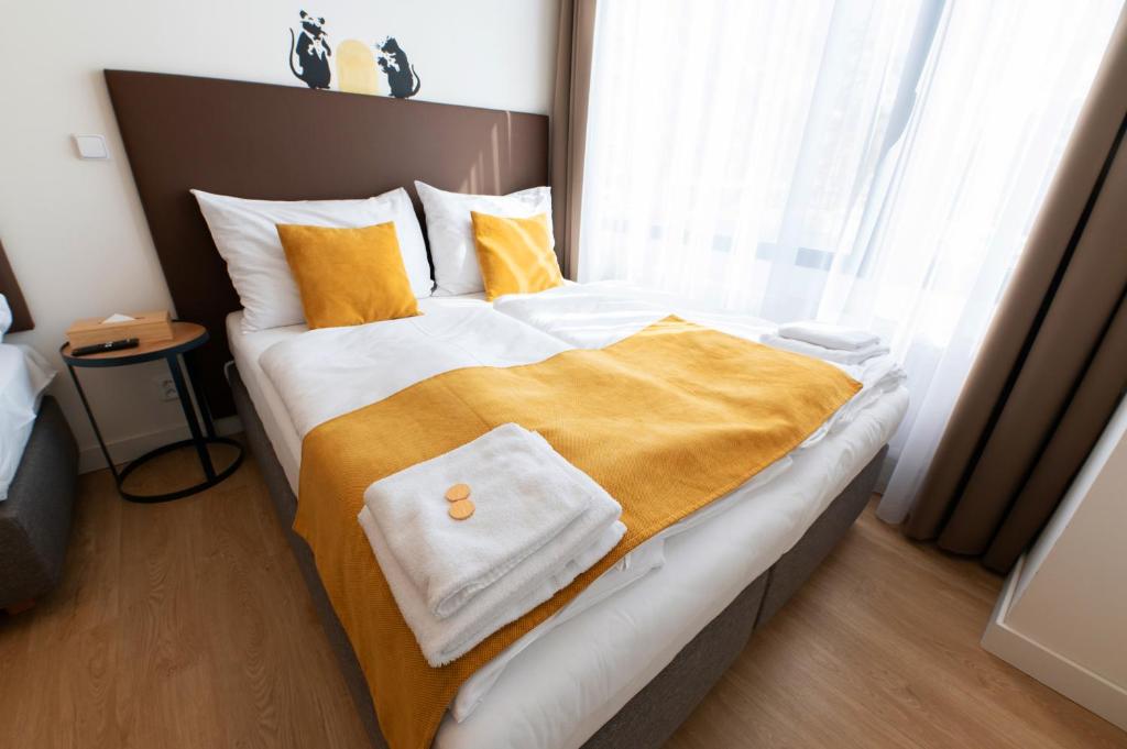 Postel nebo postele na pokoji v ubytování Post 120 Suites