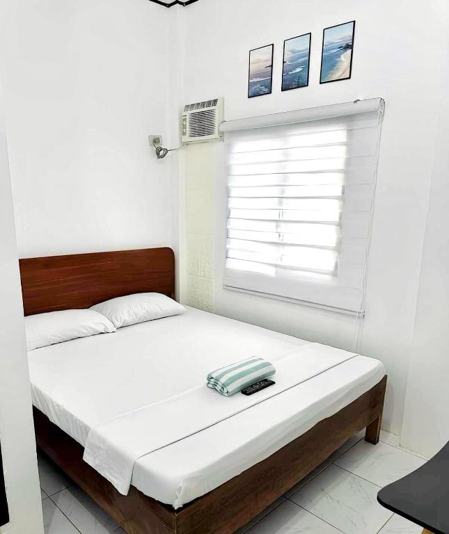 Postel nebo postele na pokoji v ubytování Wakim’s INN