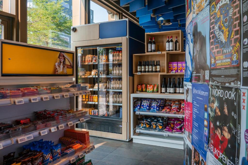 a store filled with lots of drinks and alcohol at MEININGER Hotel Amsterdam City West in Amsterdam
