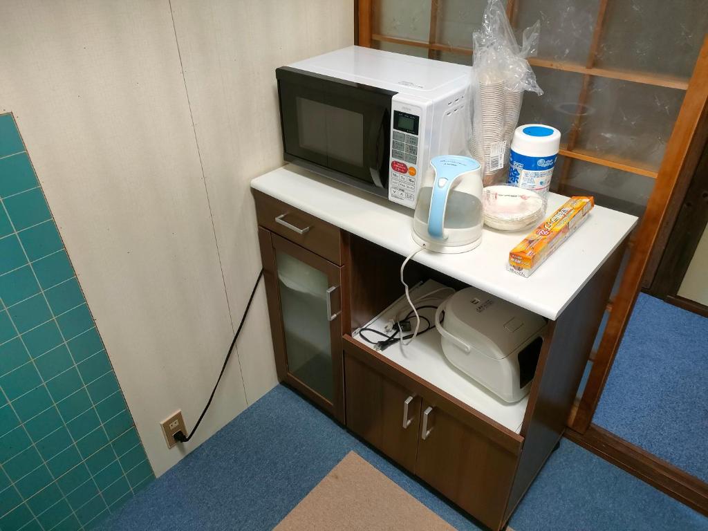 TV a/nebo společenská místnost v ubytování INN Sodeshi 丹後 一棟貸し 海の宿 INN袖志