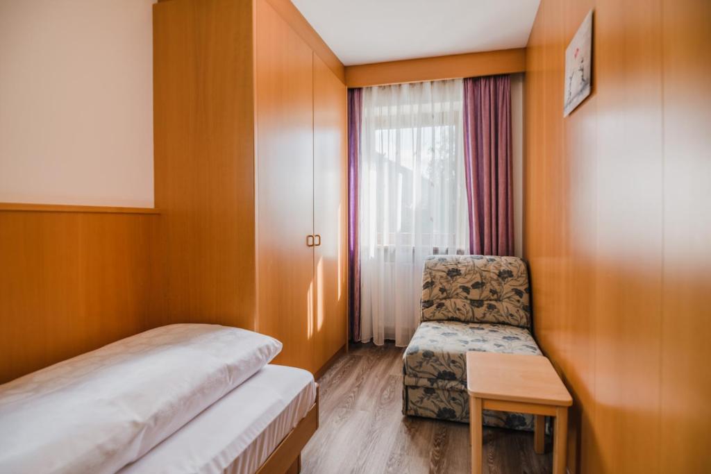 Postel nebo postele na pokoji v ubytování Residence Erika - Apartments, Breakfast & Sauna