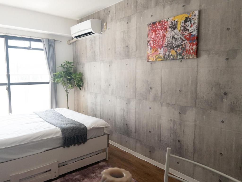 Postel nebo postele na pokoji v ubytování HARMONY HOTEL Urawa