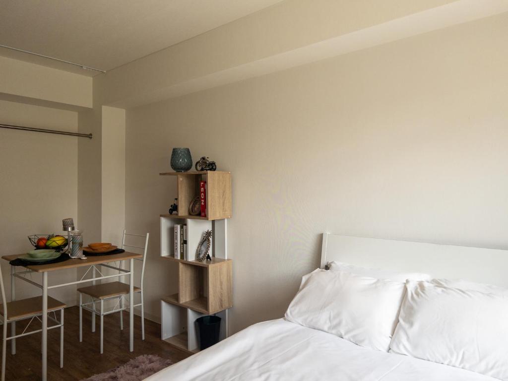 Postel nebo postele na pokoji v ubytování HARMONY HOTEL Urawa