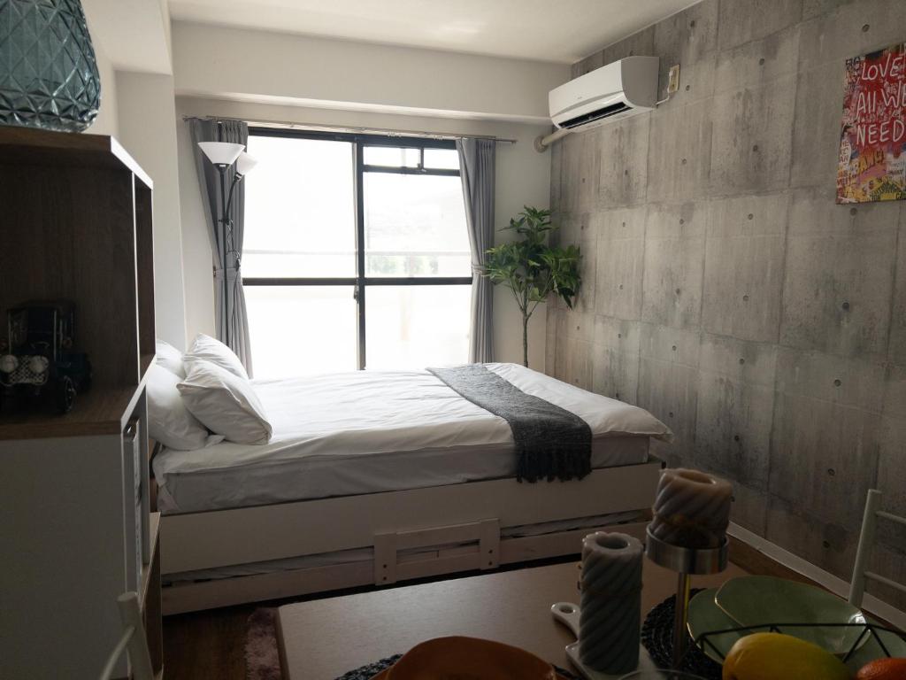 Postel nebo postele na pokoji v ubytování HARMONY HOTEL Urawa