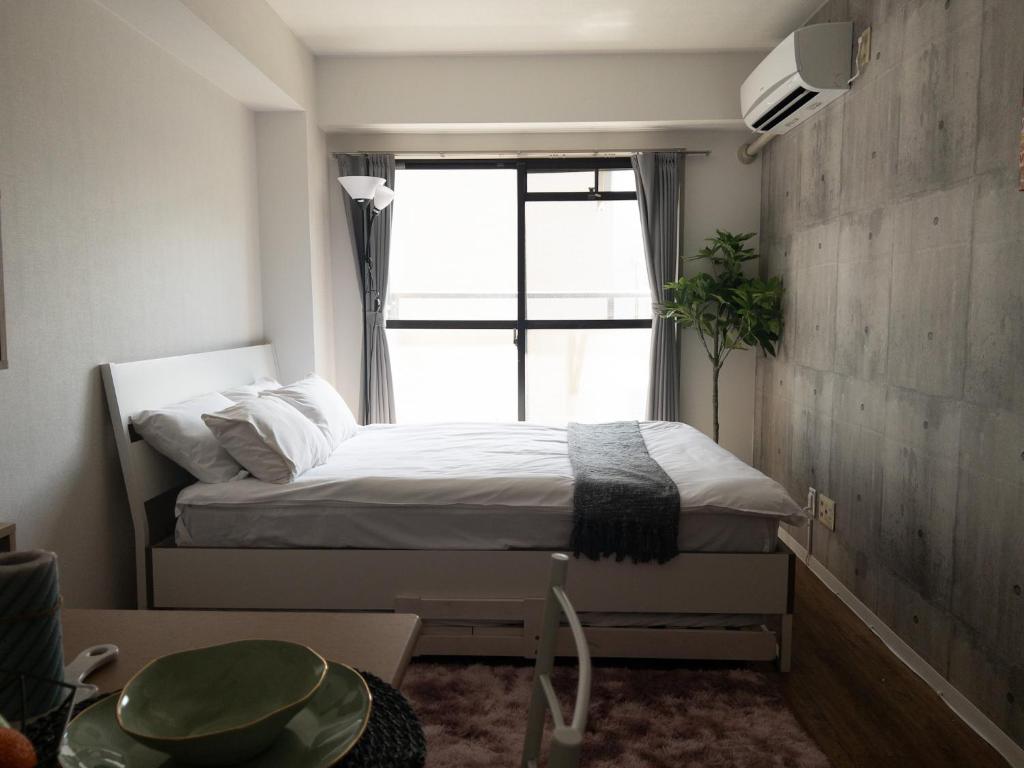 Postel nebo postele na pokoji v ubytování HARMONY HOTEL Urawa