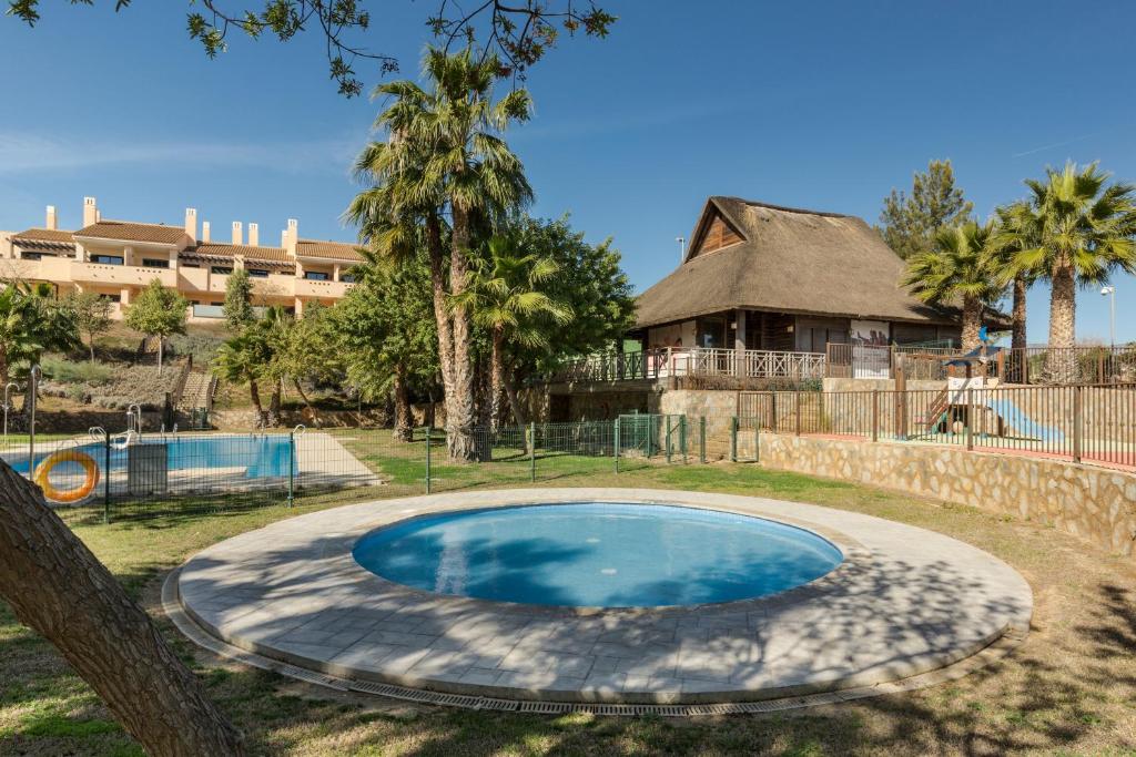 a swimming pool in the yard of a house at El Oasis Martinica 2 Bajo B in Fuente Alamo