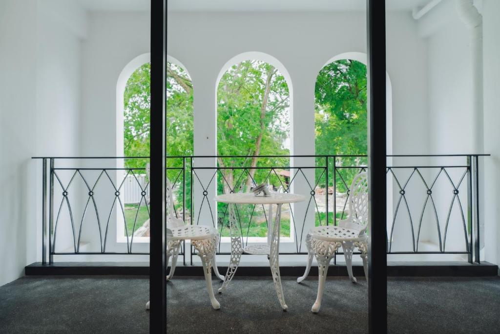 Een balkon of terras bij Xinlor House - Phuket Old Town