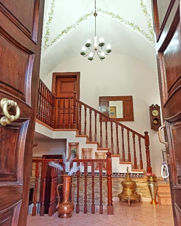 a hallway with a spiral staircase in a house at Meraviglie Salentine in Lequile