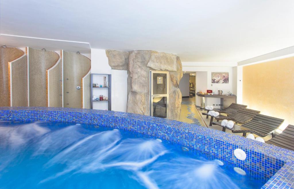 a house with a swimming pool and a living room at Virgilio Grand Hotel in Sperlonga