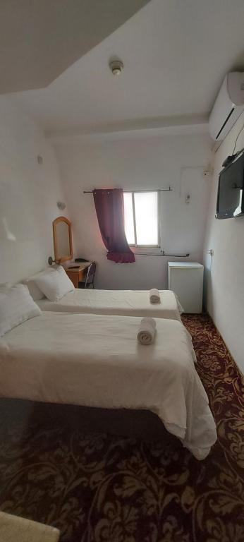 Postel nebo postele na pokoji v ubytování Zion Hotel