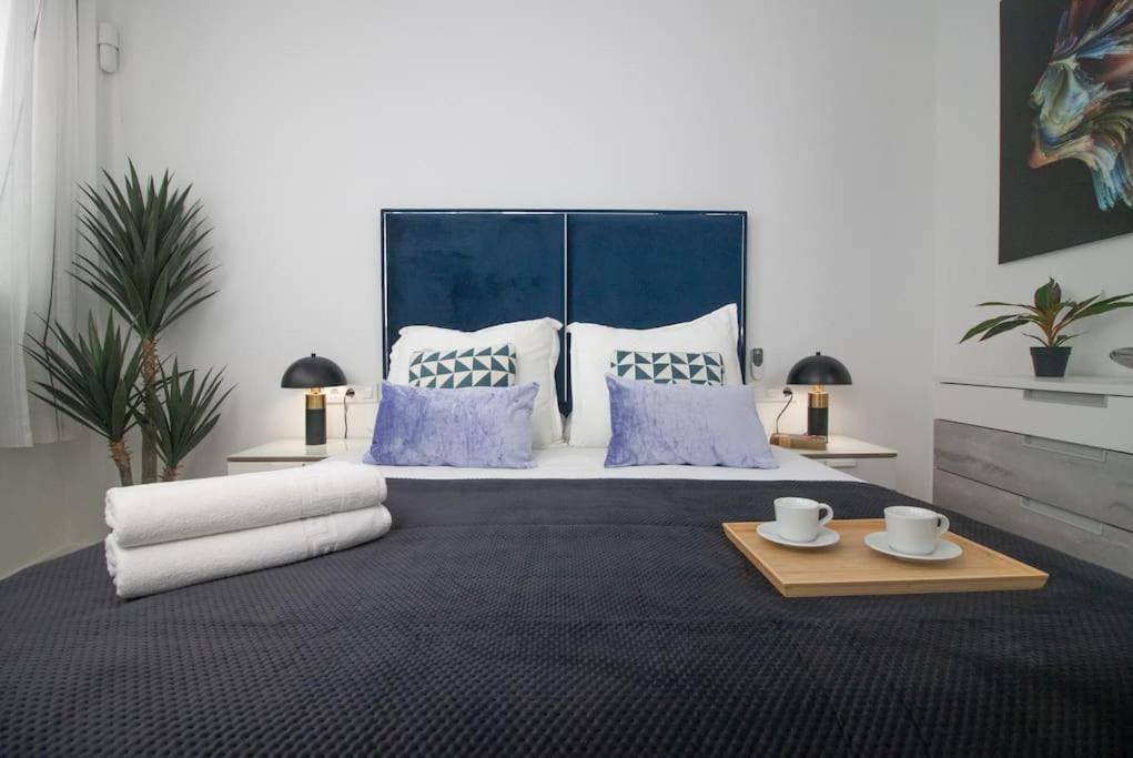 Ένα ή περισσότερα κρεβάτια σε δωμάτιο στο Trinidad Aparment