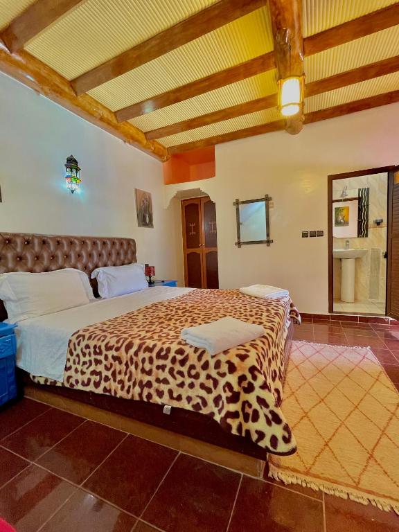 Postel nebo postele na pokoji v ubytování Hotel L'Arganier d'Ammelne