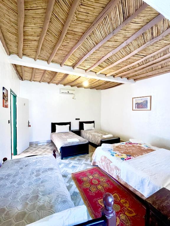 Postel nebo postele na pokoji v ubytování Hotel L'Arganier d'Ammelne
