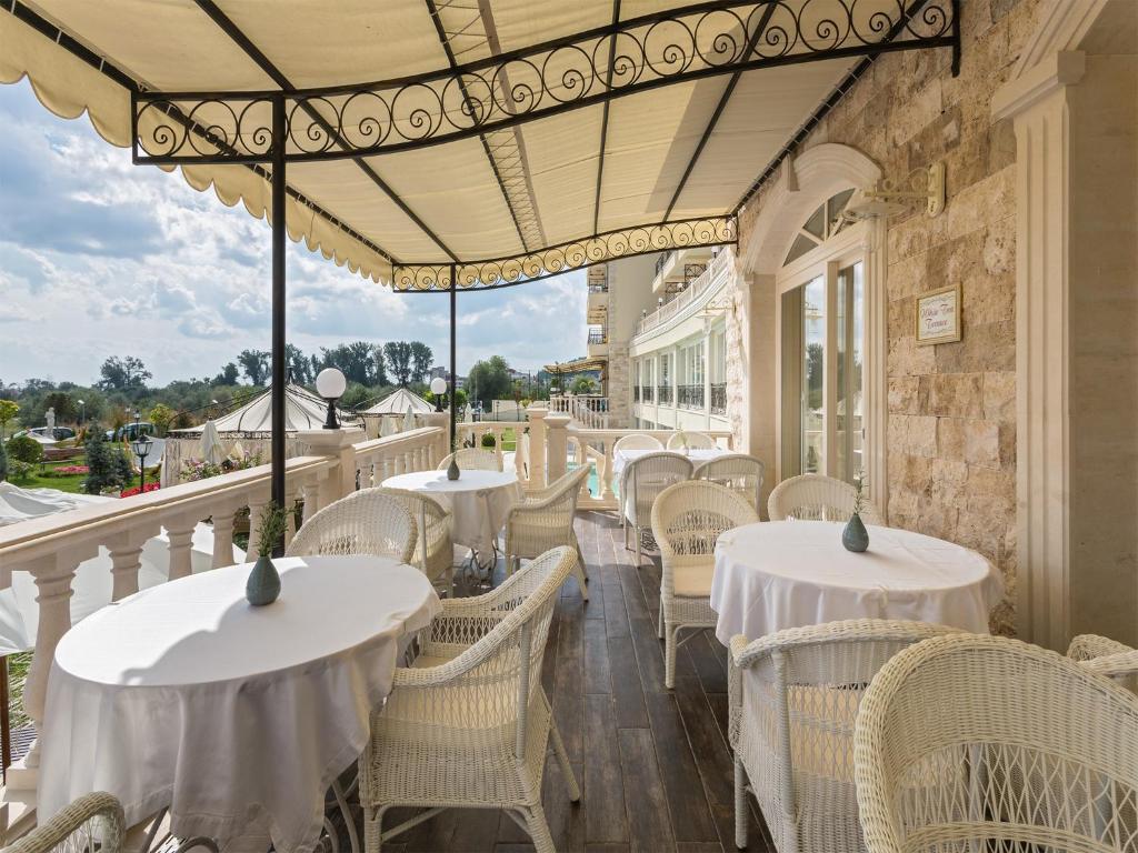 A balcony or terrace at Therma Palace - All inclusive & Private Beach & Free Parking