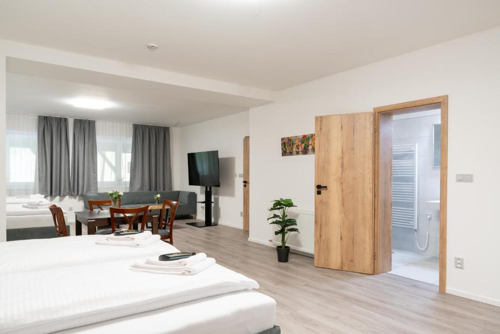 Postel nebo postele na pokoji v ubytování Apartmány LAGUNA