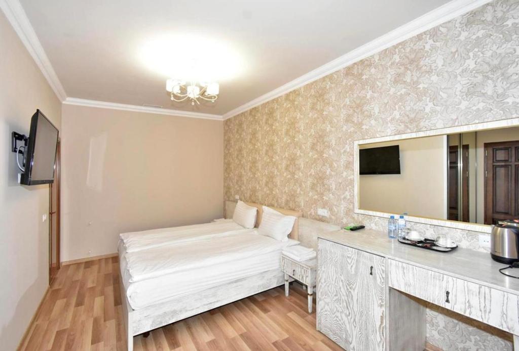 Postel nebo postele na pokoji v ubytování Homestay Hotel