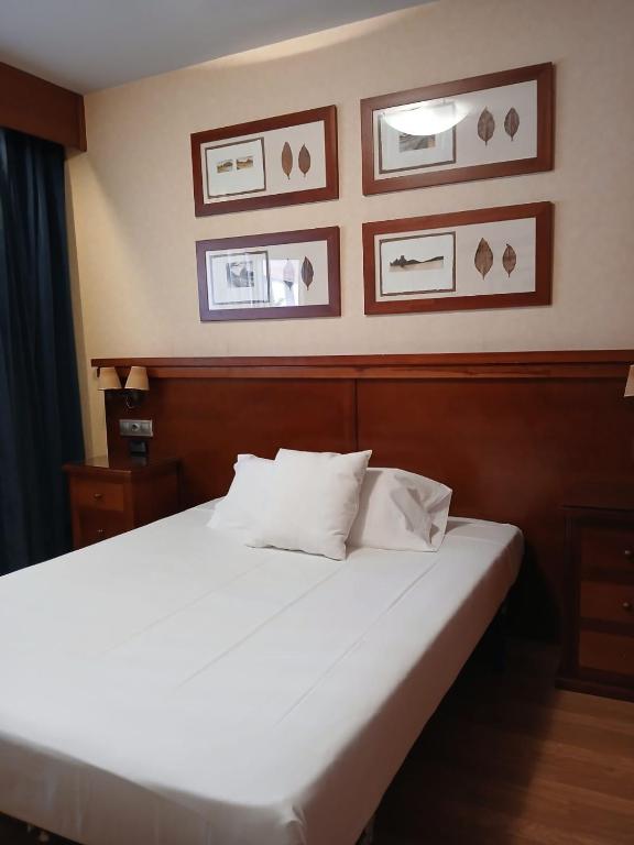 Postel nebo postele na pokoji v ubytování Hostal Los Infantes