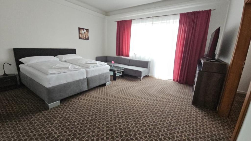 Postel nebo postele na pokoji v ubytování Apartmány LAGUNA