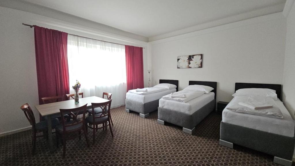 Postel nebo postele na pokoji v ubytování Apartmány LAGUNA