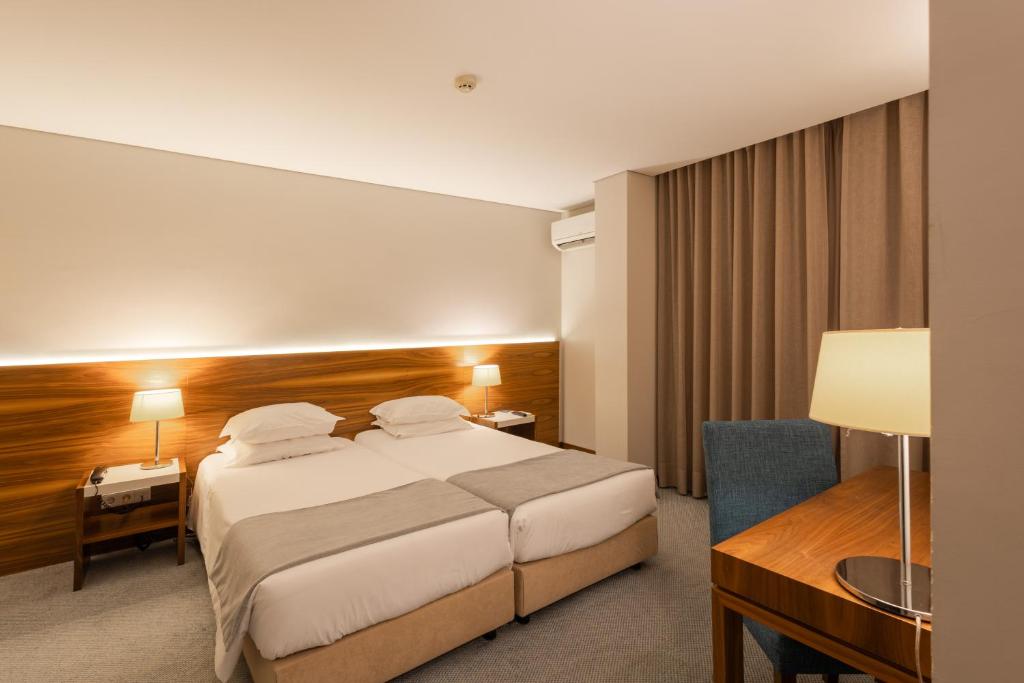 Uma cama ou camas num quarto em Hotel Navarras