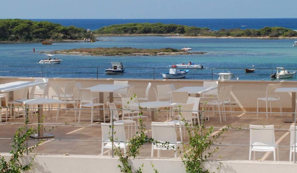 a view of a harbor with boats in the water at Hotel Grecale in Porto Cesareo