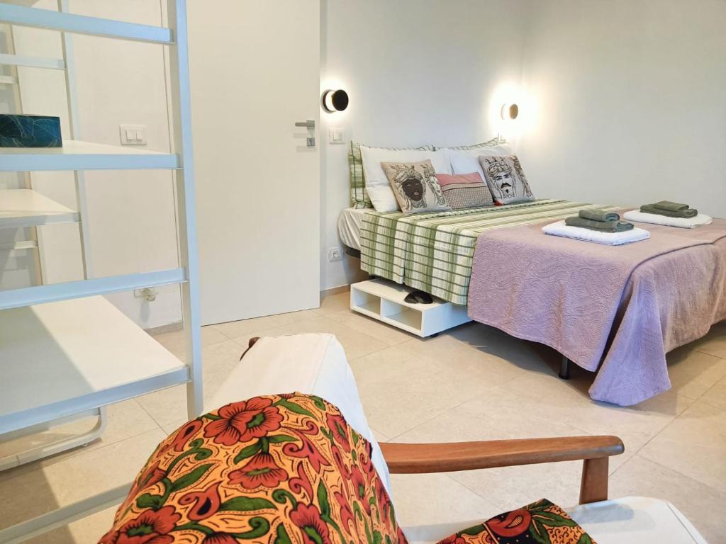 Postel nebo postele na pokoji v ubytování Acciana Rooms