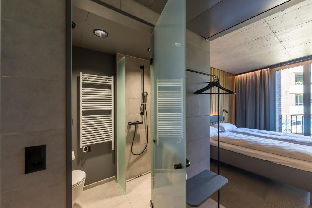 Postel nebo postele na pokoji v ubytování Zleep Hotel Zürich-Kloten
