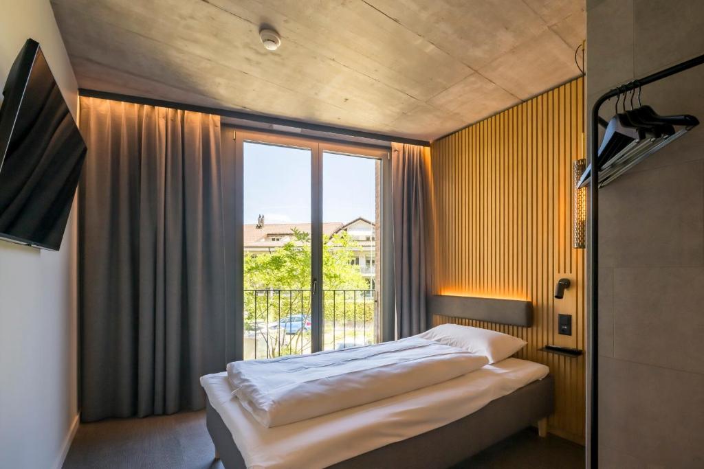 Postel nebo postele na pokoji v ubytování Zleep Hotel Zürich-Kloten