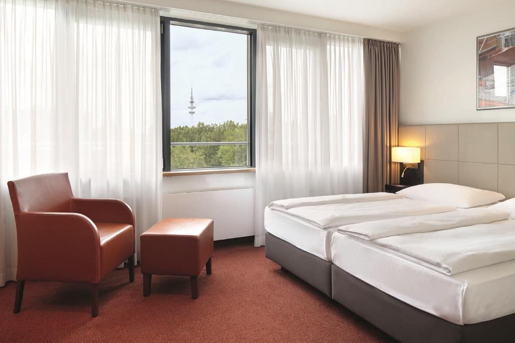 Postel nebo postele na pokoji v ubytování Hotel Hafen Hamburg
