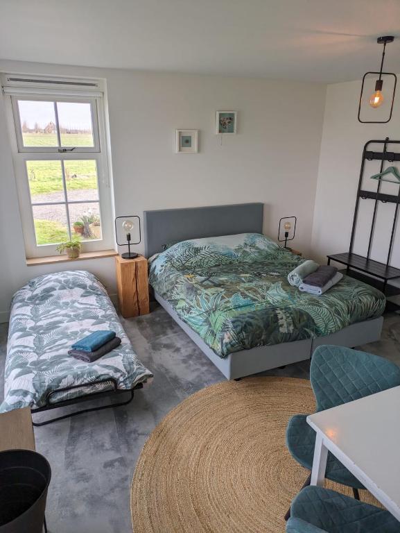Postel nebo postele na pokoji v ubytování Bed no breakfast de Kapitein