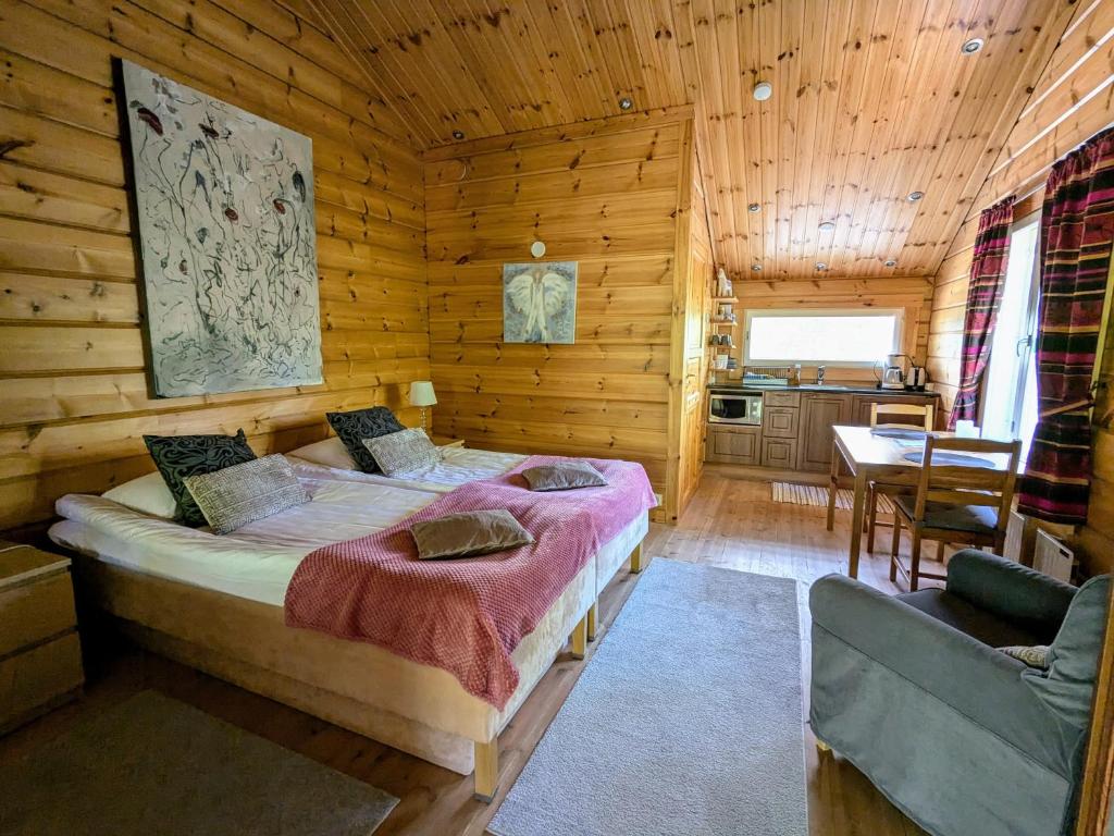 Postel nebo postele na pokoji v ubytování Santa's Little Village - Hotel Uitonniemi
