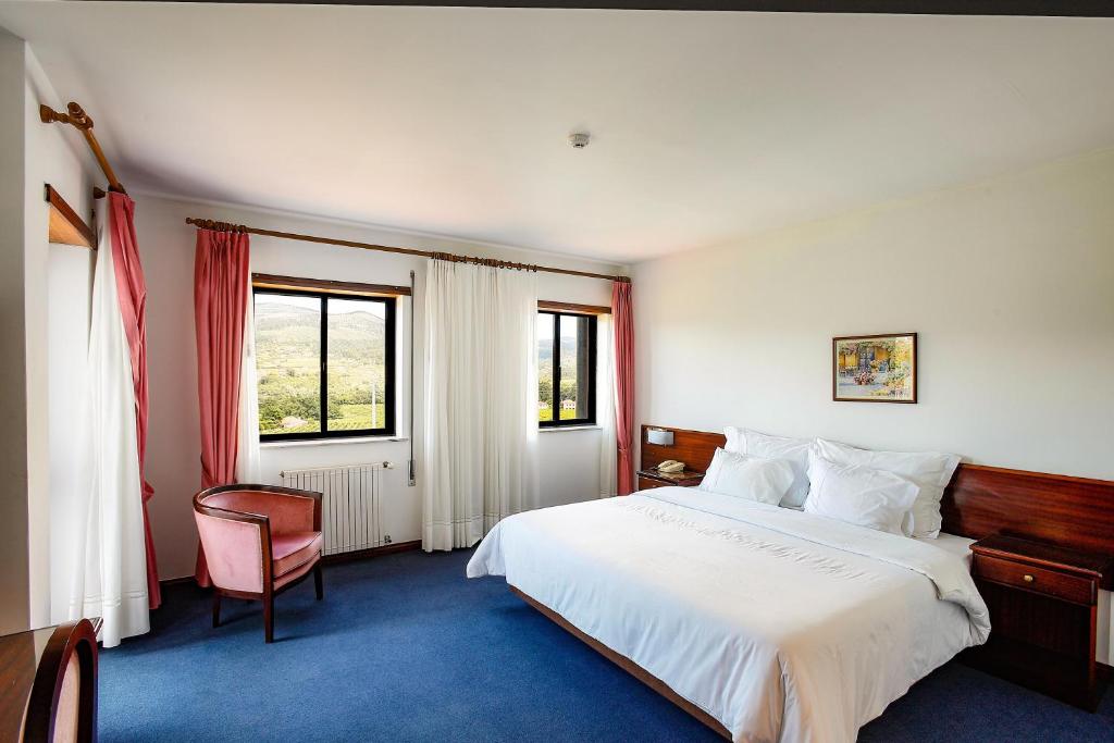 Postel nebo postele na pokoji v ubytování Hotel Boavista I