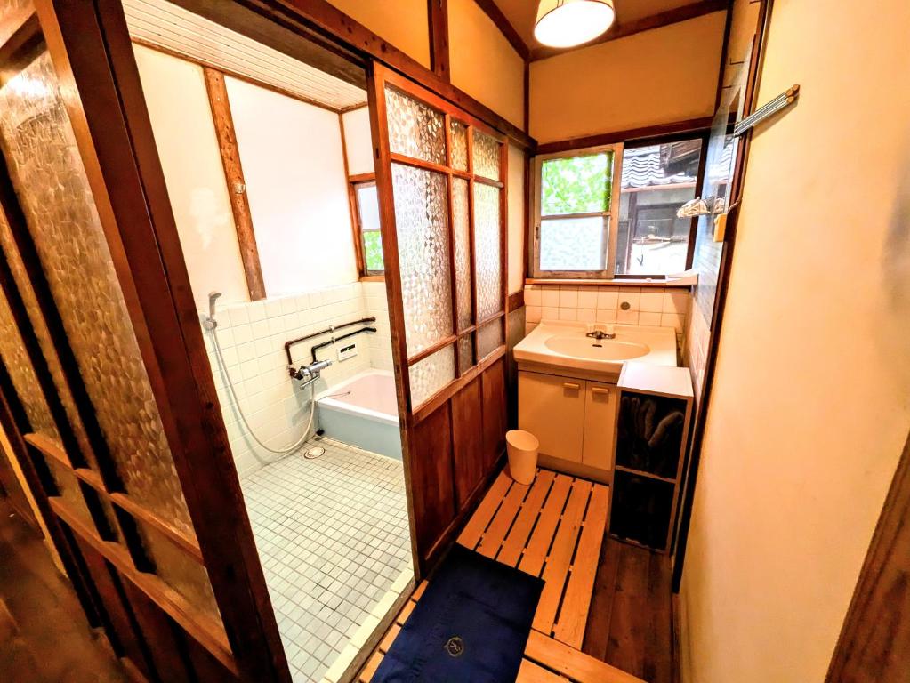 Koupelna v ubytování ゲストハウス 汀 Guesthouse NAGISA