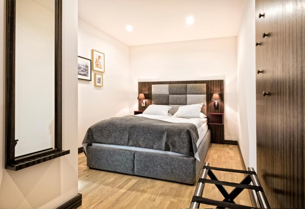 Postel nebo postele na pokoji v ubytování Sofo Hotel
