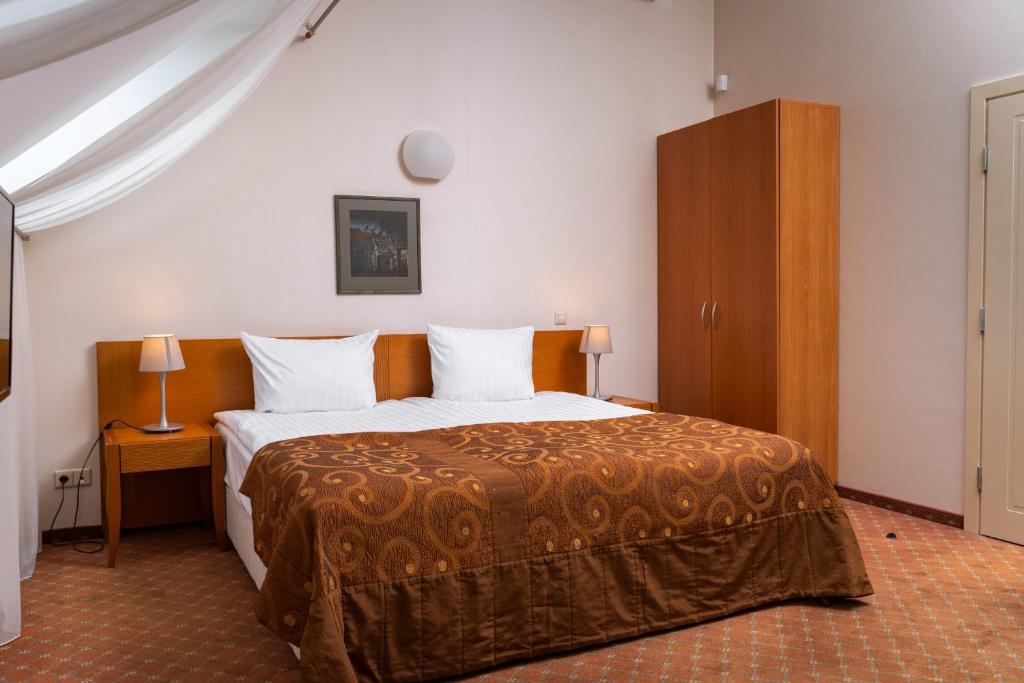 Postel nebo postele na pokoji v ubytování Mabre Residence