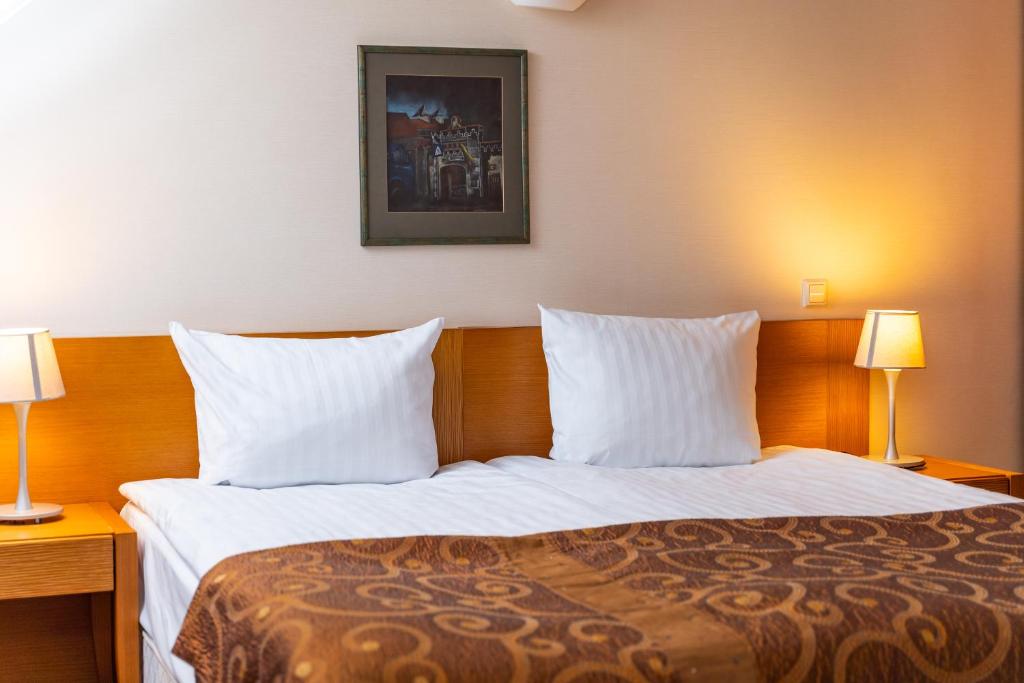 Postel nebo postele na pokoji v ubytování Mabre Residence