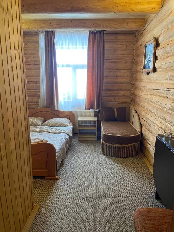 Postel nebo postele na pokoji v ubytování Шепіт Карпат