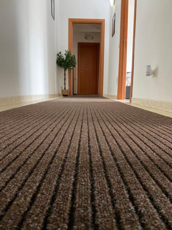 an empty room with a carpet on the floor at Pisana 247 St Peter in Rome