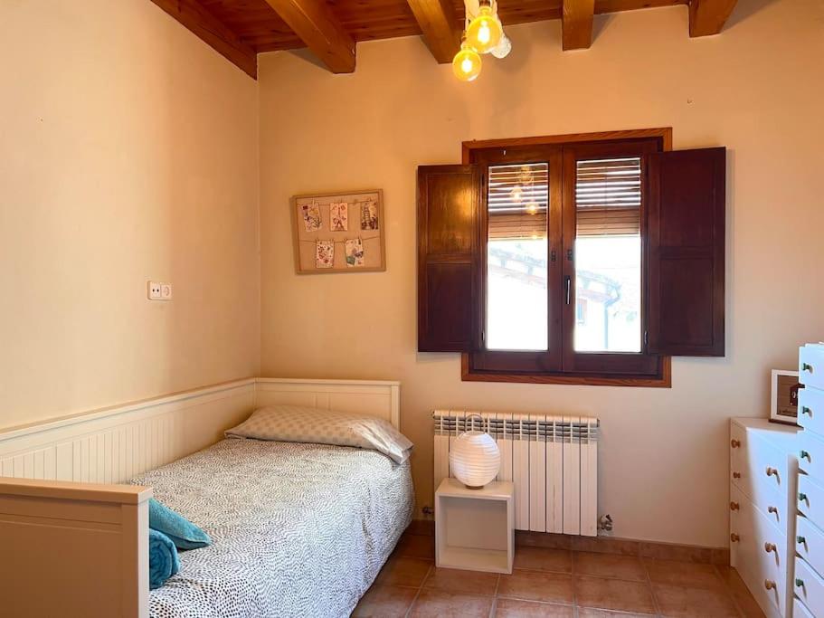 Cama o camas de una habitación en Casa Rural Martinach - L'Amfitriona