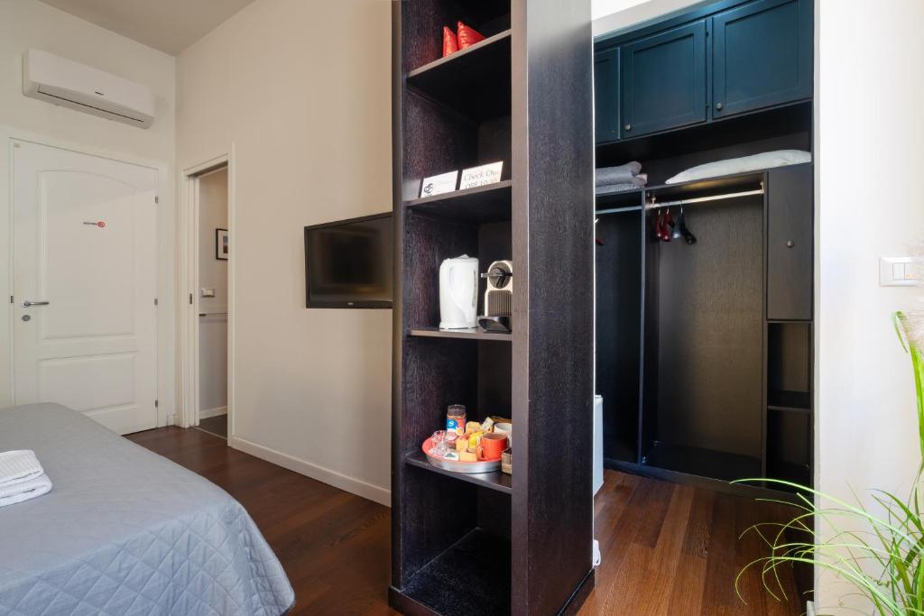 Łóżko lub łóżka w pokoju w obiekcie B&B Parigi