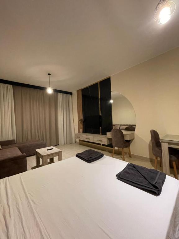 A television and/or entertainment centre at AlDau Heights Apartments