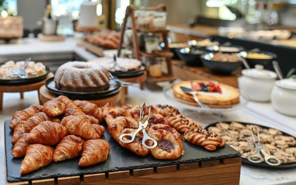 a buffet of pastries and croissants on a table at Grandhotel Brno in Brno