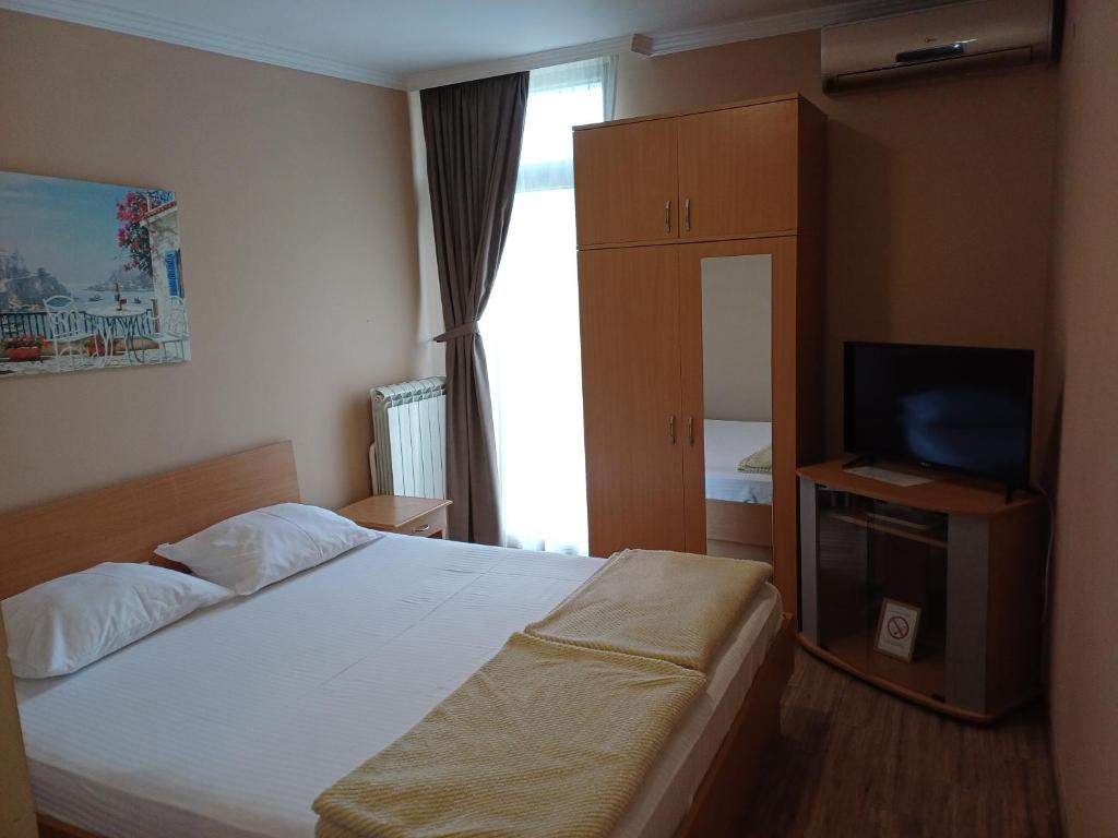 Postel nebo postele na pokoji v ubytování Hotel Marina OASA