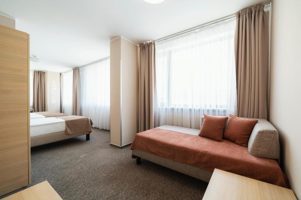 Postel nebo postele na pokoji v ubytování Hotel Ehrlich Prague