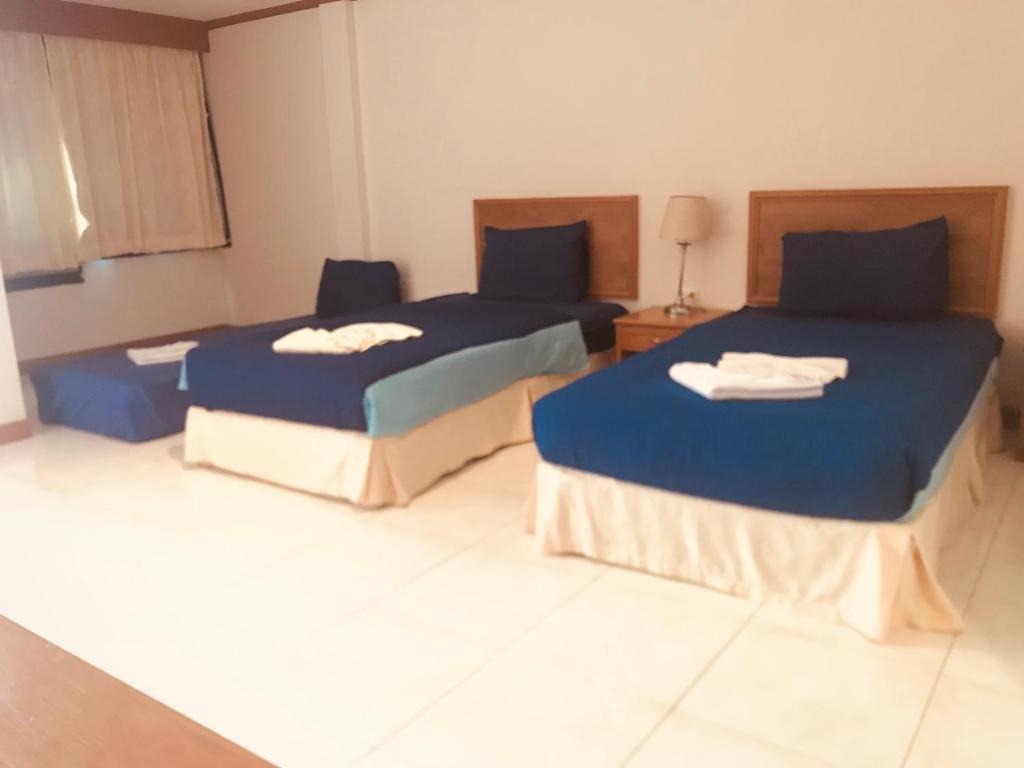 Postel nebo postele na pokoji v ubytování Global Hotel Beach View