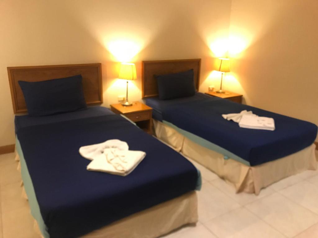 Postel nebo postele na pokoji v ubytování Global Hotel Beach View