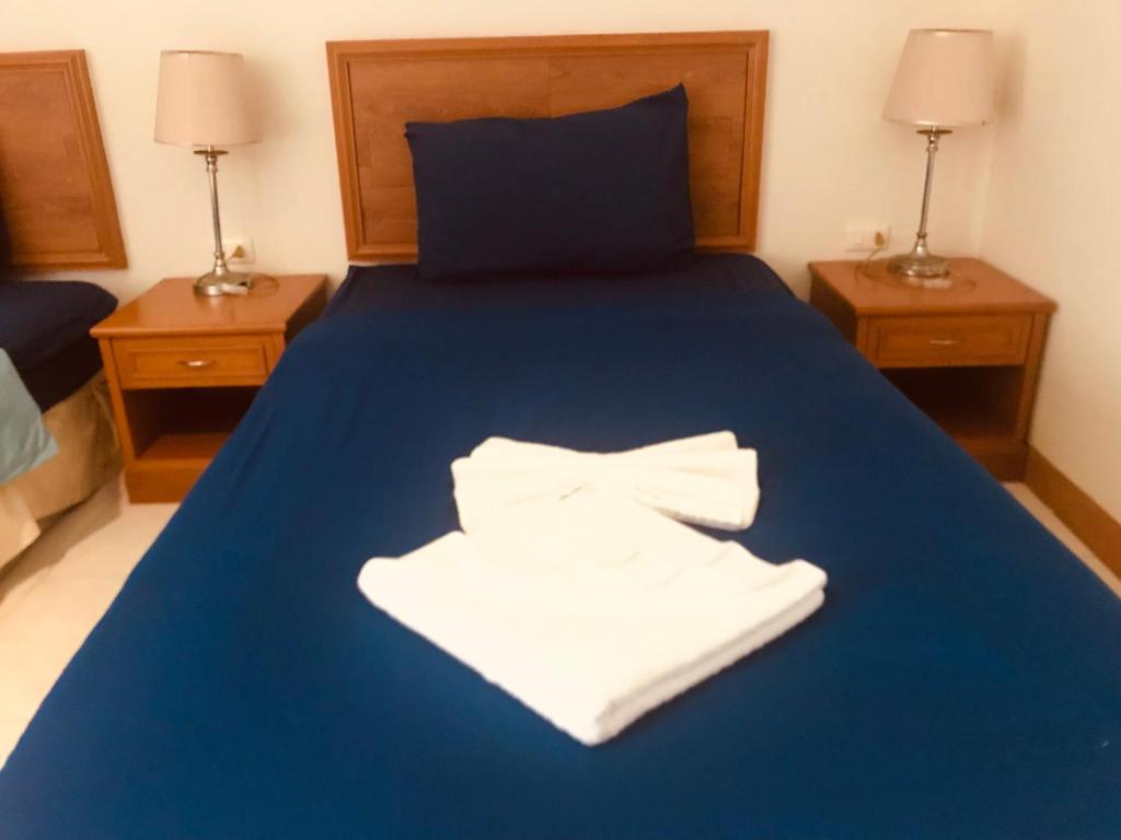 Postel nebo postele na pokoji v ubytování Global Hotel Beach View