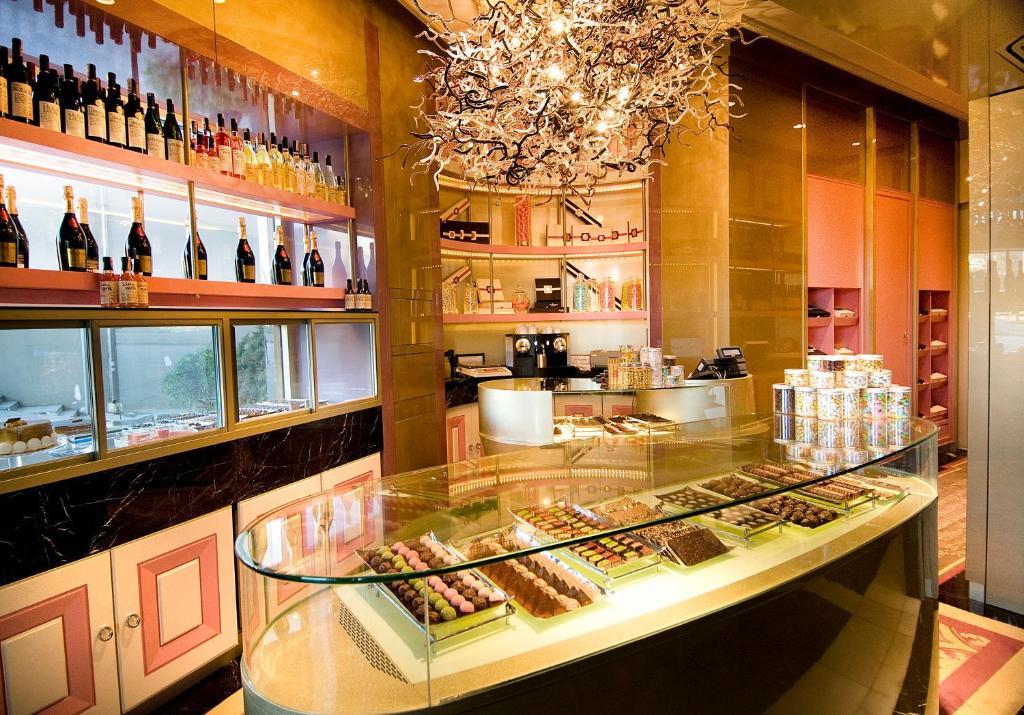 a display case in a restaurant with wine bottles at The Marmara Taksim in Istanbul