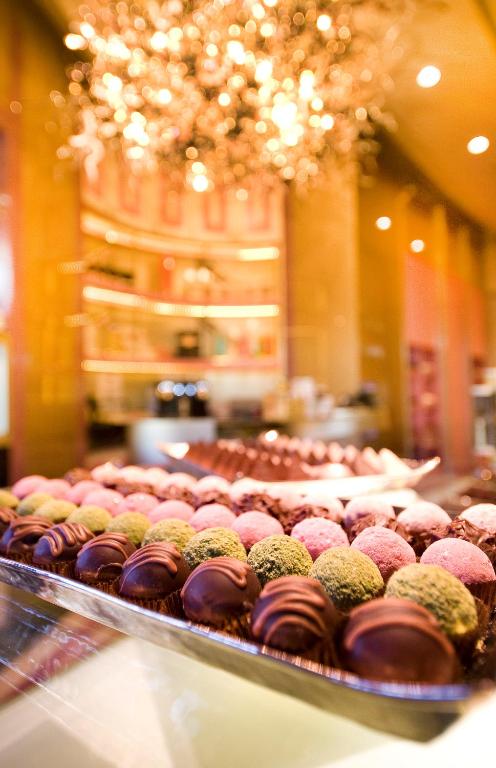 a display case filled with lots of different types of donuts at The Marmara Taksim in Istanbul