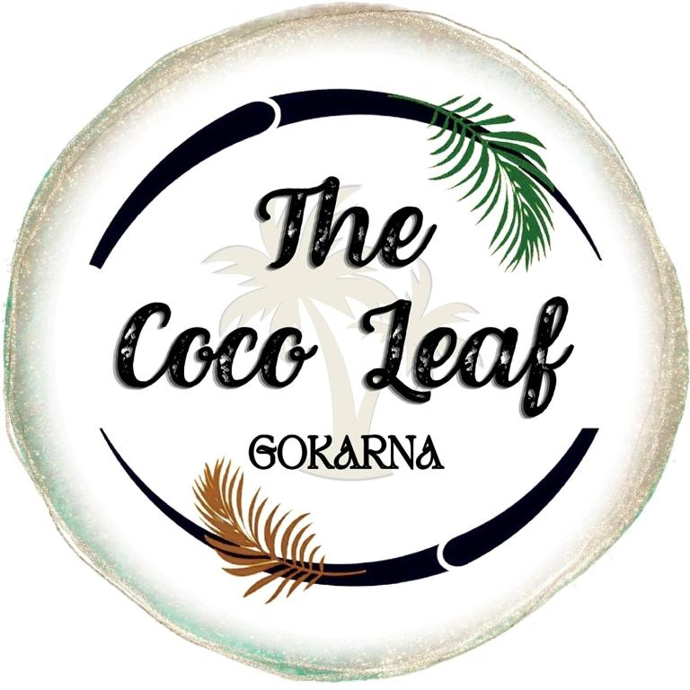a round glass plate with the cole leaf company logo at The Coco Leaf Cafe in Gokarna